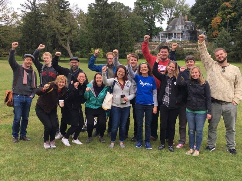 PEC members smile and raise fists after canvassing